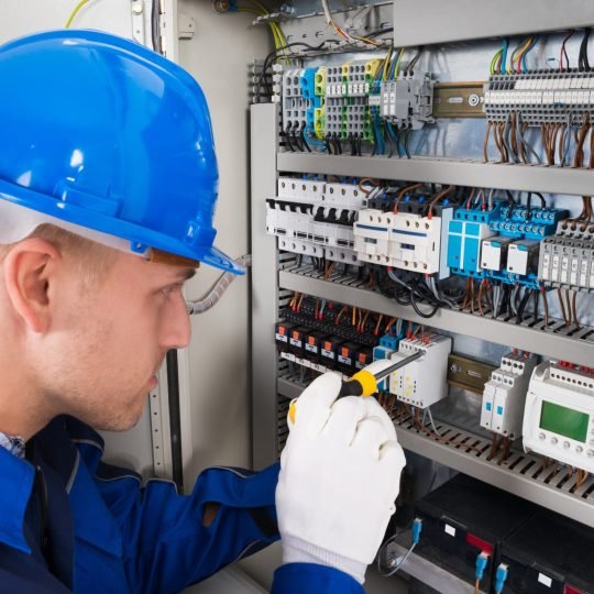 Electrician repairing electrical board in new jersey