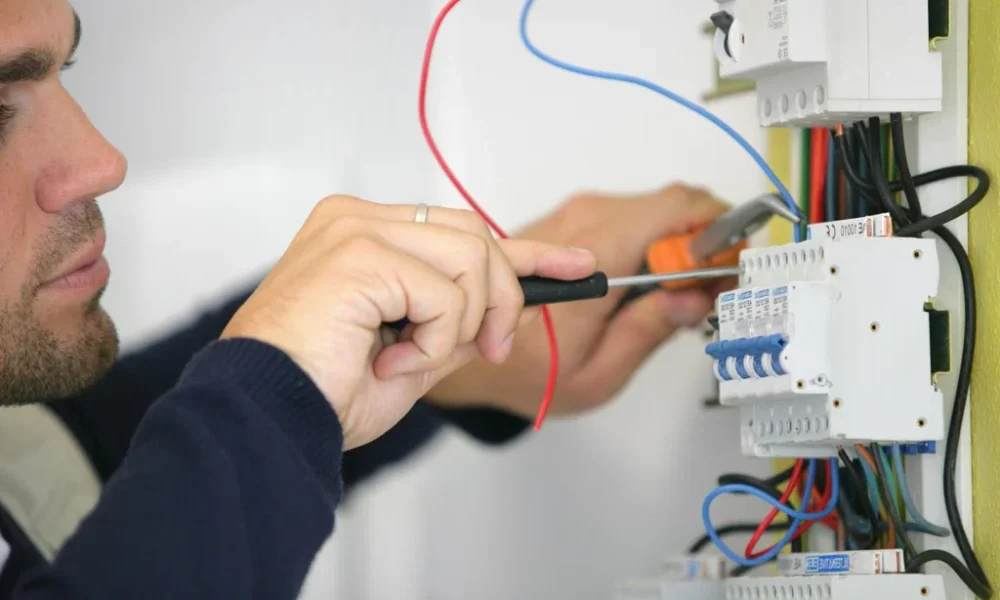 Electrician repairing electrical boaed in new jersey